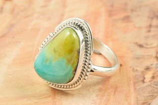 Genuine Crow Springs Turquoise set in Sterling Silver Ring. The Crow Springs Mine is located near Tonopah, Nevada. Created by Navajo Artist Larsen Lee. Signed. 
